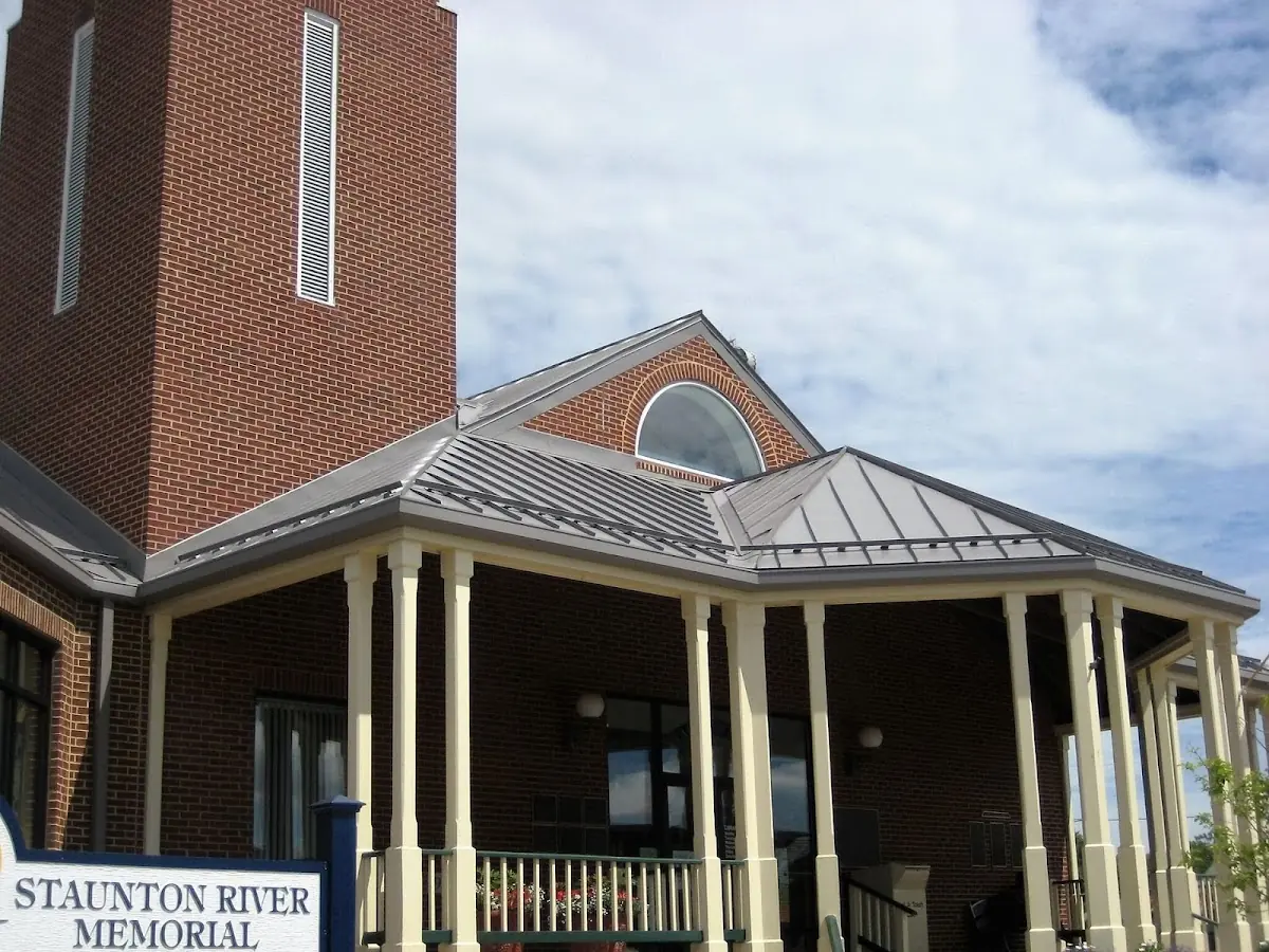 Skilled roofing craftsmen working on a residential roof in Byron